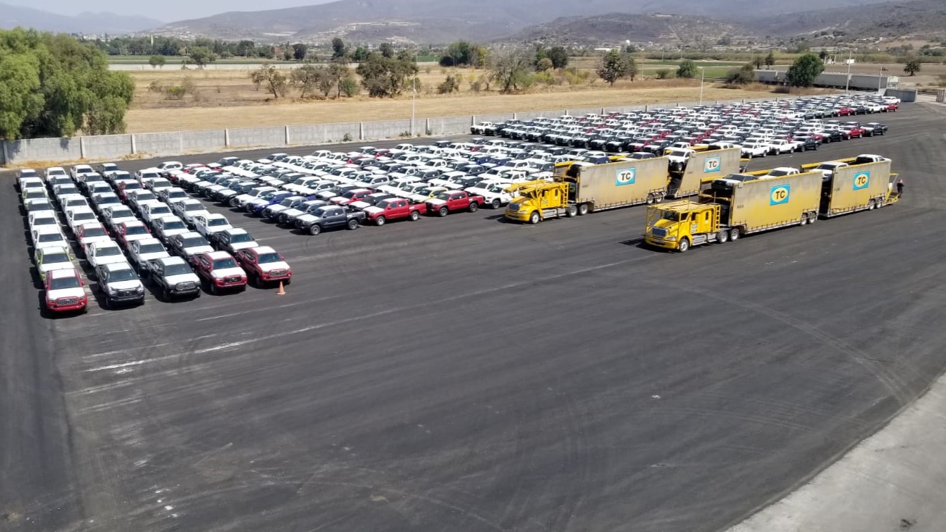 Finished vehicles and auto transport trucks at the Bajío terminal